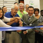 Individuals cutting the ceremonial ribbon (L to R): Cindy Brief, President/CEO of Coral Springs Chamber of Commerce; Lou Cimaglia, City Commissioner of Coral Springs; Wilson Aihara, President/CFO of Green Light Home Care.
